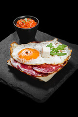 Healthy breakfast with eggs, dry meat and vegetables