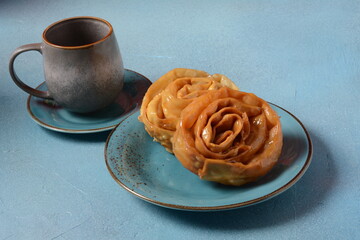 Fresh baked chebakia for ramadan. Chebakia moroccan pastries. Made of strips of dough rolled to resemble a rose, deep-fried until golden, then coated with a syrup made of honey and rosewater.