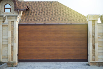 Modern sliding plastic gates for a private house.
