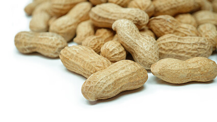 Heap of dried peanuts, Monkey nuts, Groundnuts, Isolated on white background, Close up