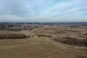 Fototapeta na wymiar early spring field top view drone, abstract landscape flight