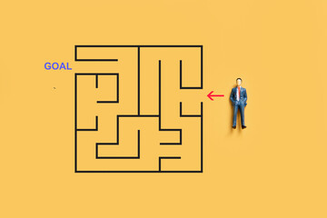 small businessman with maze riddle solving, solving algorithm to find path to goal of business