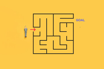 small businessman with maze riddle solving, solving algorithm to find path to goal of business