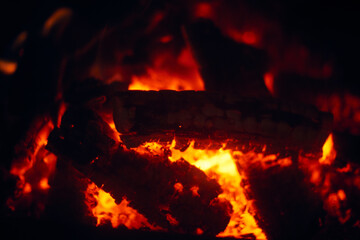 A fire burns in a fireplace, Fire to keep warm. Logs burning in a fireplace