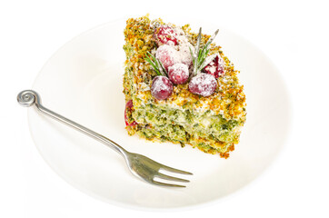 Piece of sweet cake with spinach and cranberries.