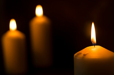 candles that are lit in the dark
