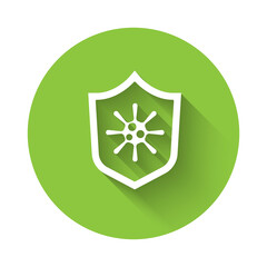 White Shield protecting from virus, germs and bacteria icon isolated with long shadow. Immune system concept. Corona virus 2019-nCoV. Green circle button. Vector
