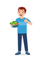 young good looking man eat fruit and vegetable