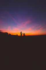 Fototapeta na wymiar surprise marriage proposal at sunset 