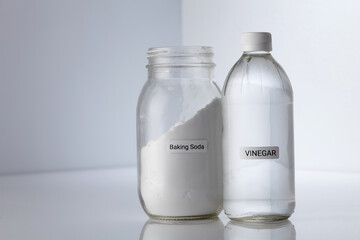 baking soda and vinegar on white background