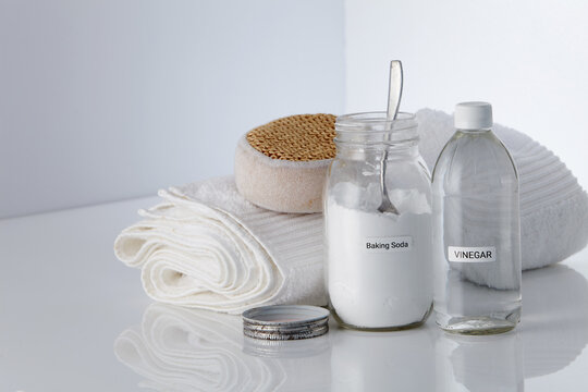 baking soda and vinegar on white background