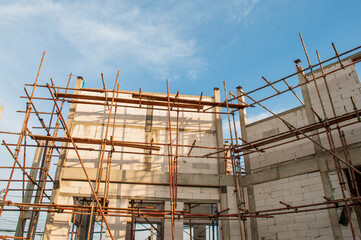 Construction of a steel scaffold on the construction site.
