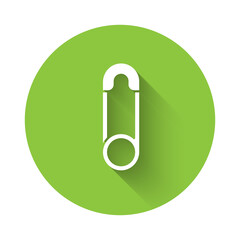 White Classic closed steel safety pin icon isolated with long shadow. Green circle button. Vector