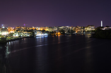 Night view of Washington DC skyline from a bridge over the Potomac river