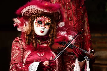 Foto op Canvas Character of a Venetian carnival who plays the violin © jakezc