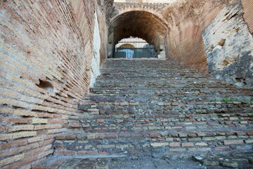 ancient roman brick stairs and arch