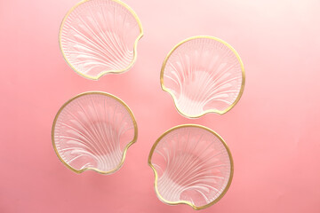 top view of many empty bowl on pink background 