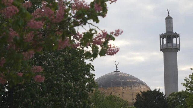 A mosque dome with a crescent moon on top.