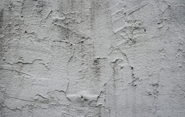 Detailed fragment of new cement wall with plaster. Gray background, texture.