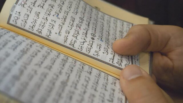 A man reading the Quran (Koran) in Ramadan.