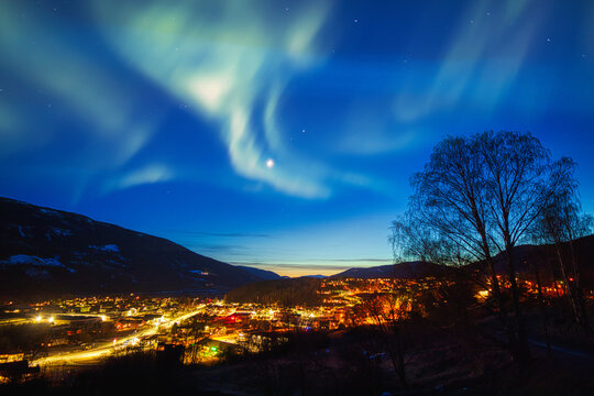 Aurora over city