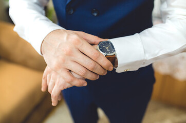 Closeup shot of a businessman checking his watch
