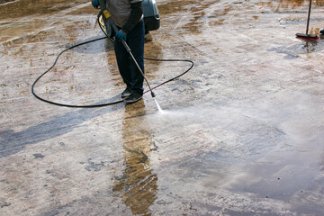Cleaning of city fountains in spring before starting work. Workers clean up the dirt that has...