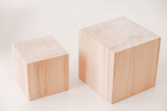 Two wooden blocks from natural wood on a white background. Copy, empty space for text