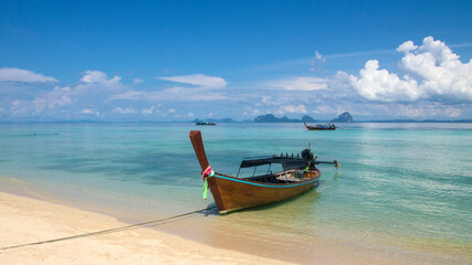 Naklejka na ściany i meble Thai longtail boat on Koh Ngai, Trang Islands (Thailand)