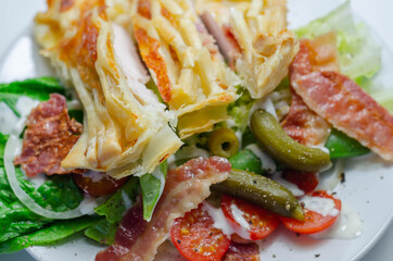 Chicken en croute, chicken breast inner fillets with mature cheddar cheese and beechwood smoked streaky bacon in a puff pastry lattice