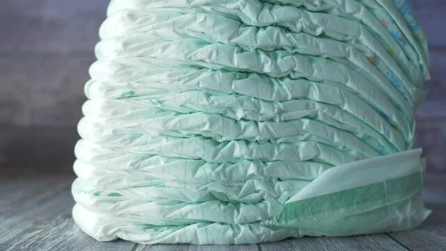 stack of baby diaper on table,