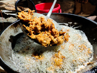 Pakure making in deep oil.Frying pakure on street shop.Oily street food.