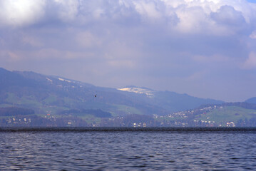 Fototapeta na wymiar Lake Vierwaldstättersee seen from landing point Vitznau, Lucerne, Switzerland. Photo taken April 14th, 2021.