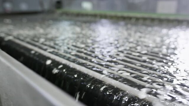 Washing machine for plastic and polymer particles.
