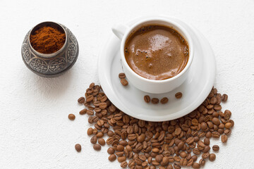 Coffee and coffee grains.  The coffee grains are ground in the coffee grinder.