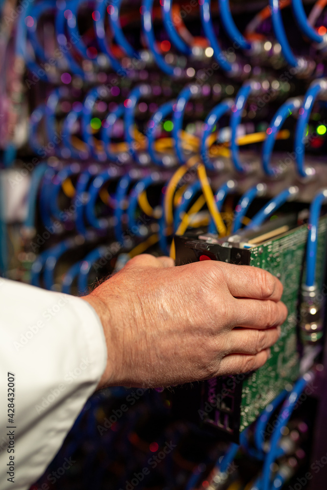 Poster Support technician installing blade server