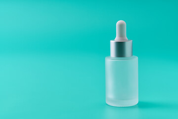 medical skin care, bottle for serum, micellar toner on blue background,selective focus.