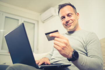 Man using credit card online