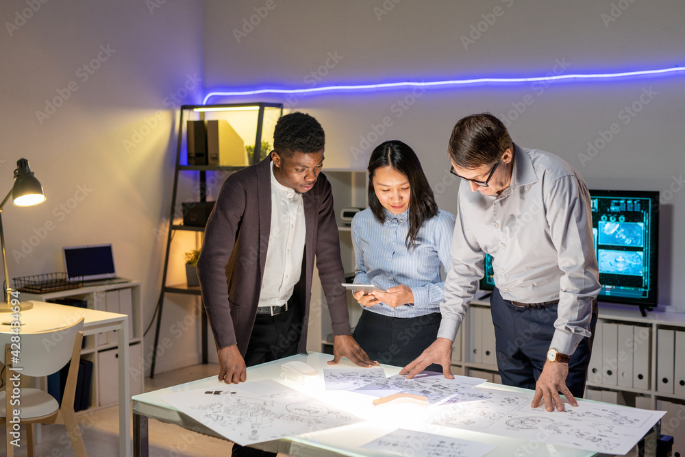 Poster team of designers discussing car model sketches