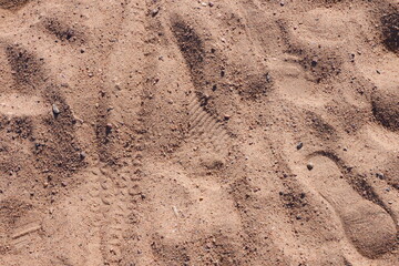 Sandy beach texture.Sand. Footprints in the sand.  Background.