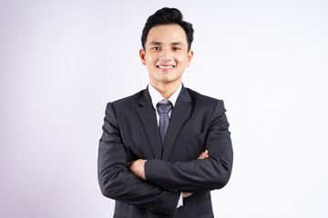 Image of young Asian businessman wearing suit on white background