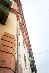 Fototapeta na wymiar Drainpipe on wall of old building.
