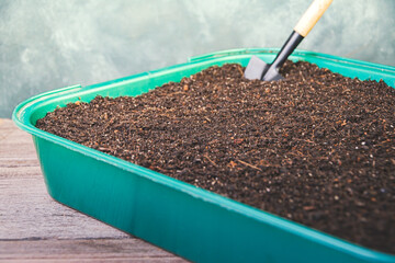 Garden soil for plants. Spring work on preparation of seedlings.