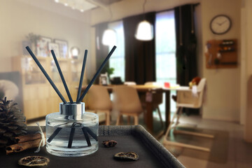 luxury aroma reed diffuser crystal glass bottle is used as room freshener on the brown table to...