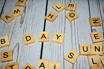 Wooden blocks with letters forming word "day"