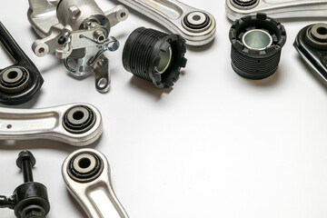 Obraz premium Car inspection. Auto motor mechanic spare or automotive piece on white background. Set of new metal car part. Automobile engine service.