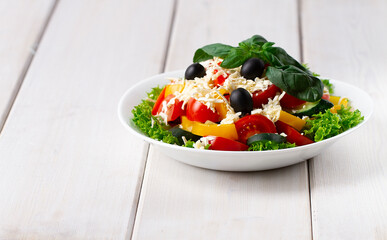  Traditional Bulgarian dish, Shopsky salad, with vegetables and cheese, on a white background, no people, horizontal,