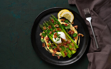 Green asparagus, with poached egg and bacon, hollandaise sauce, top view, horizontal, no people,