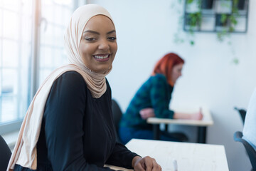 African muslim business woman wearing  hijab listening  online educational class lecture, consulting customer