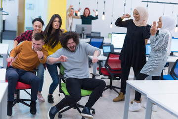 Group of  Creative office workers collaborate together making joke with each other during their work inside office. succes and competition business concept